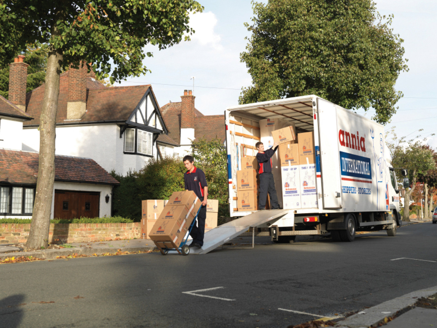 BMI Taking Items Out of Van in Street