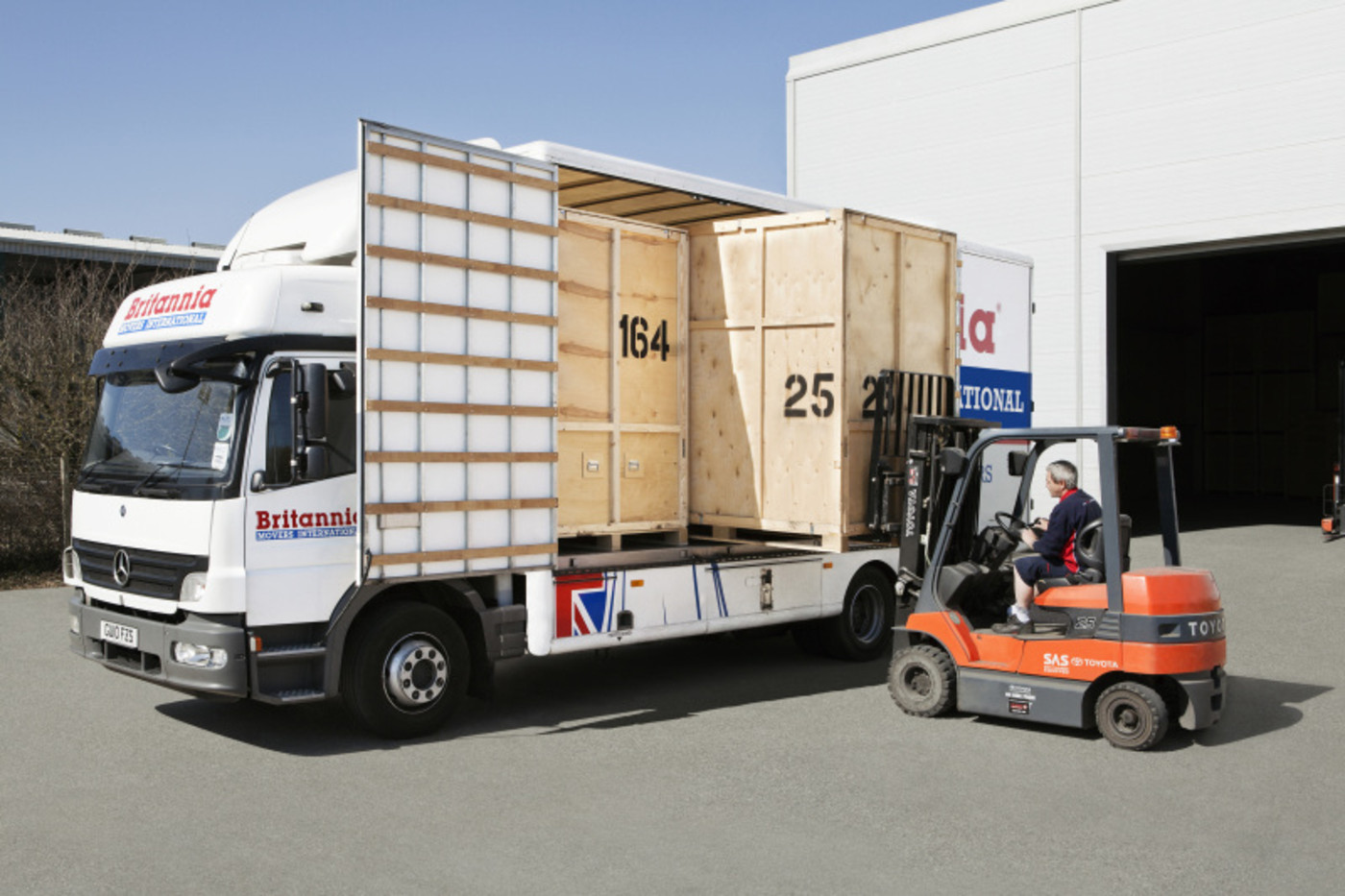 Forklift Taking Boxes Out of Van